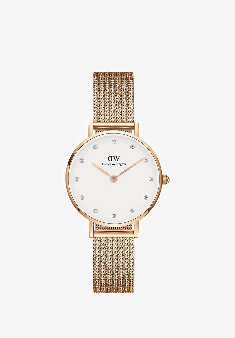 Rožu zelta acu siksna pulkstenis ar apaļu balto ciparnīcu, sudraba stundu rādītājiem un logotipu. Iezīmē gludu tekstūru un minimālistisku dizainu.