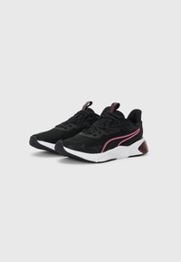 Black athletic shoes with a breathable mesh upper, contrasting pink accents, white midsole, and textured rubber outsole.