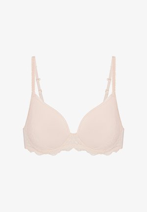 Hüftfreier BH in hellem Nude mit Spitzenbesatz, der glatte Schalen, verstellbare Träger und einen gewellten Saum am unteren Rand für zusätzliche Details bietet.