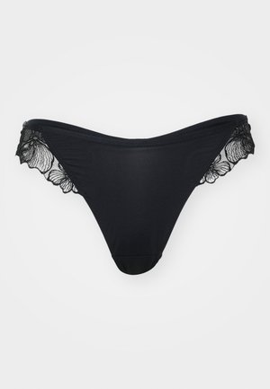 Black thong underwear with smooth fabric and delicate lace accents along the edges, featuring floral patterns on the lace trim.