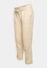 Pantalon en lin beige avec une taille élastique et un cordon de serrage. Dispose de poches latérales et d'une coupe fuselée avec des revers aux chevilles.