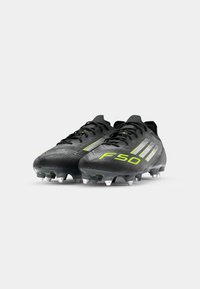 adidas Performance F50 ELITE SG - Soft-ground football boots - core black/iron metallic/lucid lemon