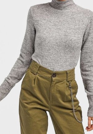 Gray long-sleeve turtleneck sweater paired with high-waisted olive green pants featuring a chain accessory on the right side.