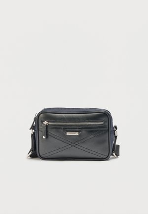 Black crossbody bag with front zipper pocket, diagonal stitch detailing, silver metal "Iceberg" logo, and adjustable strap on a plain background.