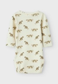 Långärmad bodysuit i krämfärgad ribbad tyg, med ett upprepat brunt leopardmönster. Observera kuvertkragen och tryckknapparna längst ner.