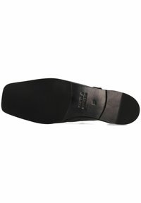 Suola di scarpa nera con finitura liscia e lucida. Presenta un motivo di trazione in gomma testurizzata per migliorare la presa. Dettagli del logo del marchio stampati.