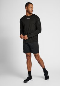 Hummel TIHALT - T-shirt de sport - black