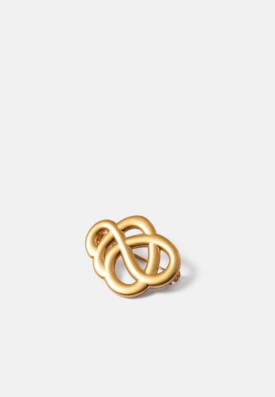 Broche de metal em tom de ouro com um design de nó infinito entrelaçado. Apresenta curvas suaves e arredondadas, além de um fecho de pino seguro.