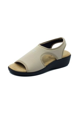 Sandal beige con punta aperta, con una soletta imbottita, cinturino slingback e una suola a cuneo nera. Finitura strutturata e dettagli cuciti.