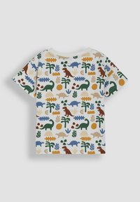Kortærmet bomulds t-shirt med et farverigt dinosaur- og bladmotiv på en lys cremefarvet baggrund, med rund hals og afslappet pasform.