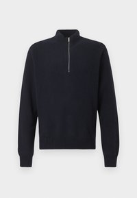 Pull en maille côtelée noire à manches longues avec col zippé jusqu’à mi-hauteur, présenté sur un fond gris uni.