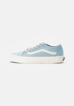 Light blue canvas sneaker with white laces, rubber outsole, and signature side stripe. Round toe and padded collar for comfort.