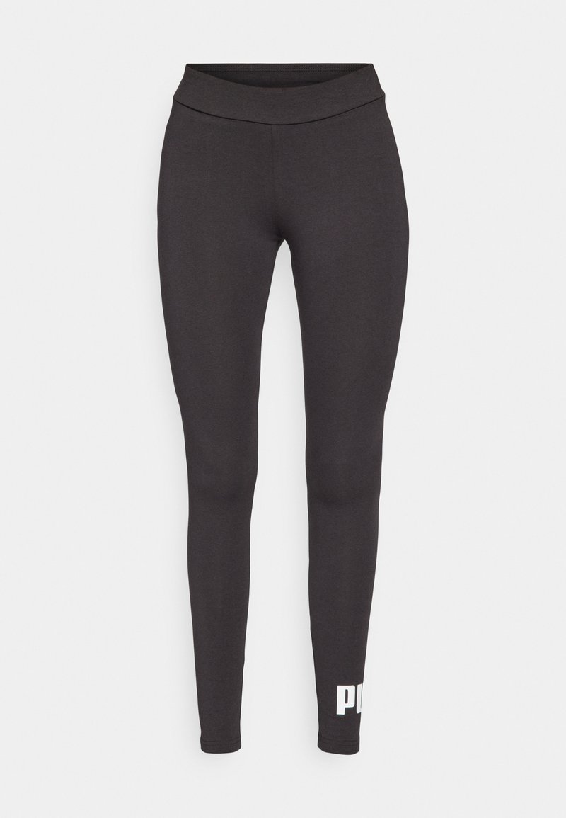 Leggings neri realizzati in tessuto elastico, con una cintura alta e un logo bianco stampato sulla parte inferiore della gamba sinistra. Texture liscia.