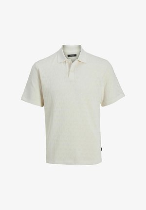 Kortermet polo skjorte i off-white, strukturert strikket stoff. Har krage og tre-knapp placket. Subtil sikksakk-mønster.