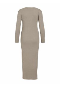 Ribbed, long-sleeve, bodycon dress in a neutral beige color, features a round neckline and a full-length silhouette.