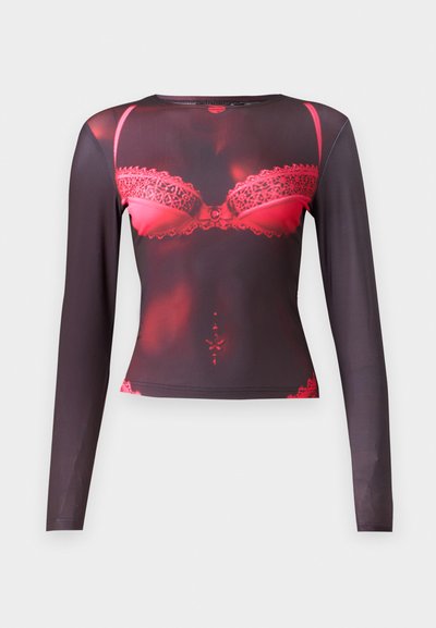 Long-sleeve top featuring a black base with a red lace bra graphic, round neckline, and a stretchy, smooth texture.