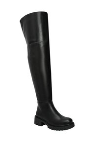 Botte en cuir noire montante avec semelle épaisse et bout rond, conçue pour un port à la fois élégant et durable.