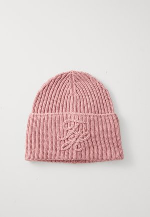 Pink knitted beanie with ribbed texture and a folded cuff, featuring a decorative embroidered logo on the front.