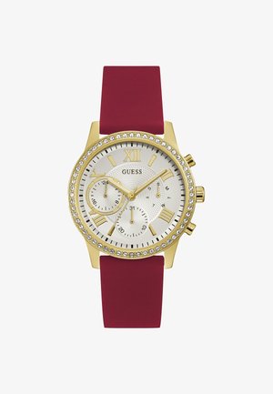 Zlatý náramkový hodinky s okrúhlym bielym textúrovaným ciferníkom, zlatými rímskymi číslicami, chronografovými subciferníkmi a vínovočerveným silikónovým remienkom. Vynikajúce s kryštálmi.