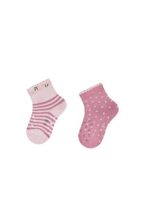 Two pink baby socks side by side, one striped with flowers at the cuff, the other dotted with grip dots on the sole.