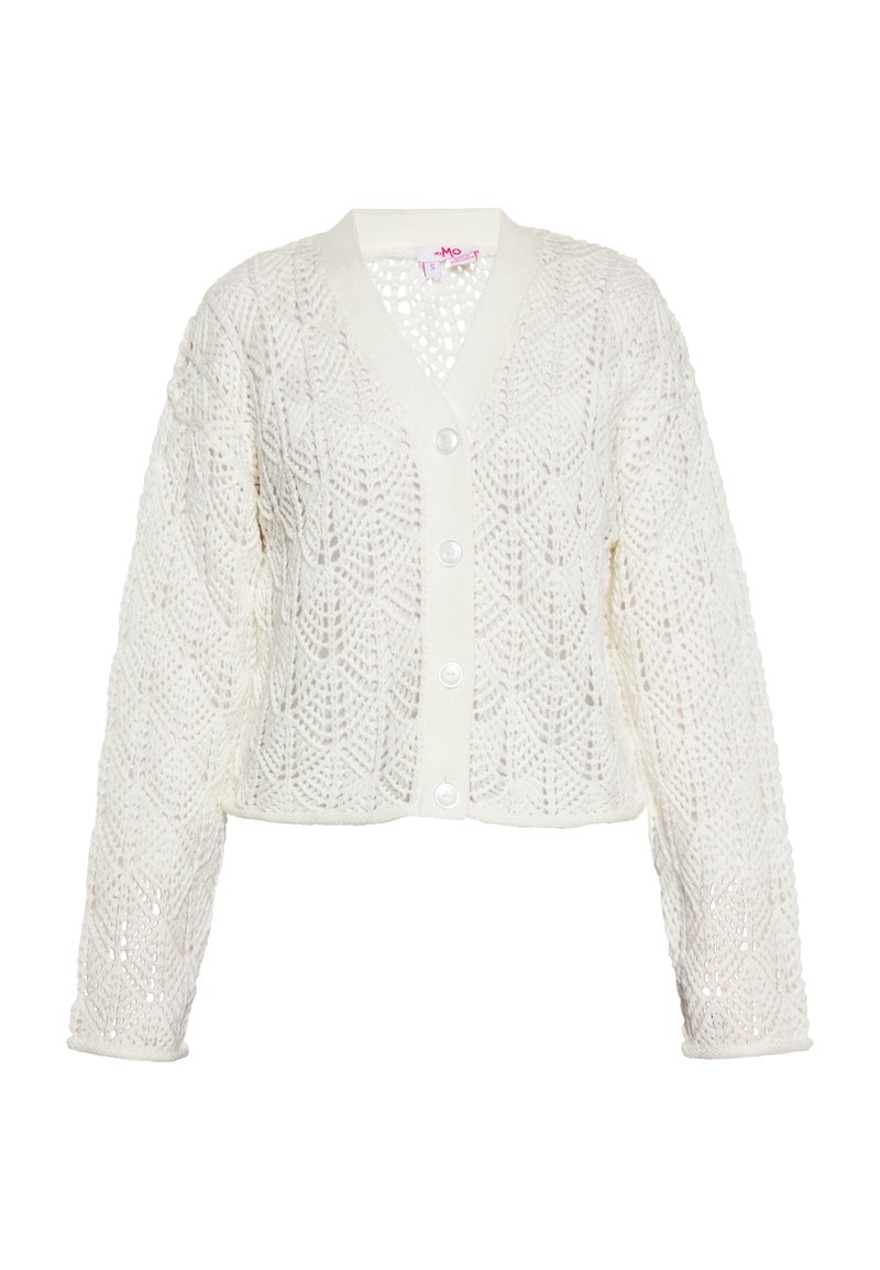 Cardigan bianco a maglia con un delicato motivo in pizzo, scollatura a V e chiusura con bottoni sul davanti. Lunghezza corta con maniche lunghe e larghe.