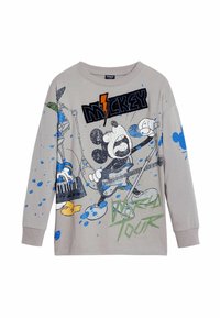 Vaaleanharmaa pitkähihainen t-paita, jossa on grafiikka Mikki Hiirestä musiikkielementtien kanssa, sinisiä maalisuihkuja ja "Mikki Maailman Kierros" -teksti.