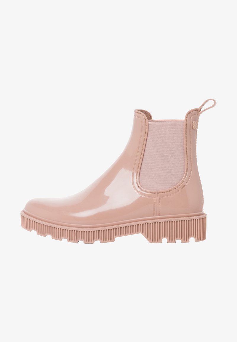 Botte de pluie chevillère rose pâle brillante avec panneau latéral élastique, semelle rainurée et languette à l'arrière pour faciliter l'enfilage.