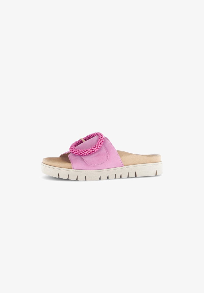 Pink slide sandal featuring a textured strap with a bead accent, cushioned insole, and a tactile rubber outsole with grooves for grip.