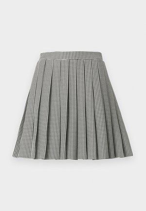 Black and white houndstooth pleated skirt with a fitted waistband and a flared silhouette, made from a lightweight fabric.