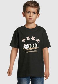 Black t-shirt featuring a graphic design of sushi and a cat on a wooden plate, with text in pink and white, made of soft cotton fabric.