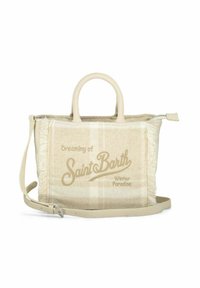 Sac à main beige en tissu doux, avec un motif à carreaux, des bords frangés et un texte imprimé. Comprend des poignées courtes et une bandoulière amovible.