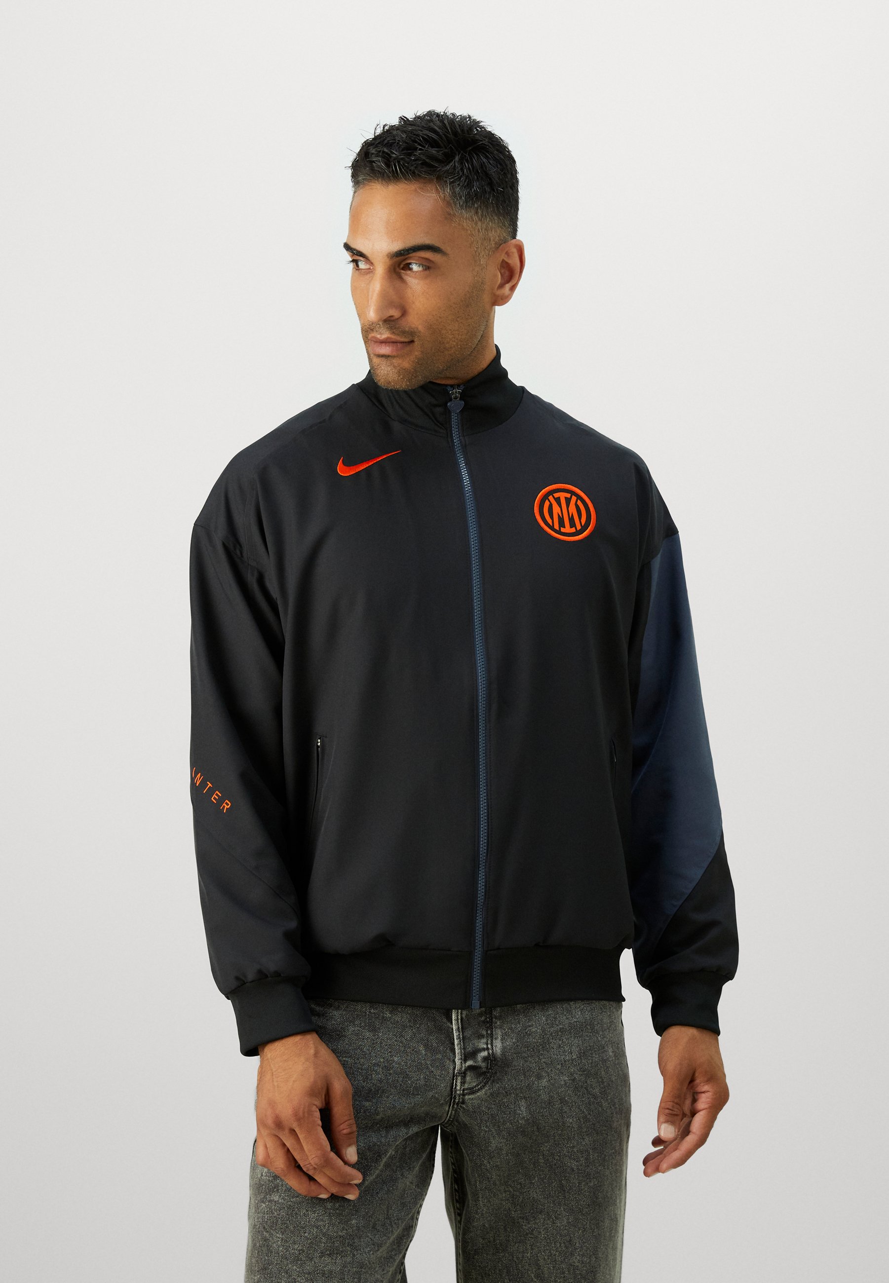 black and orange nike windbreaker