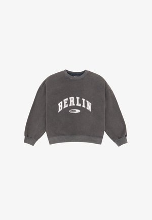 Gray cropped sweatshirt featuring "BERLIN" in bold white letters, round neckline, and long, slightly puffed sleeves. Soft, textured fabric.