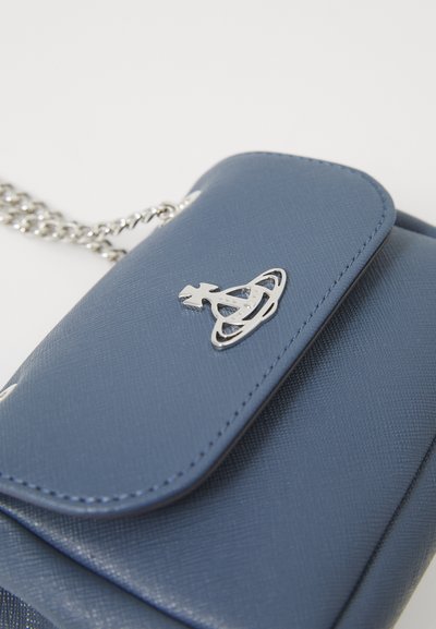 Blue synthetic leather handbag with a textured finish, flap closure, silver logo accent, and a metallic chain strap.