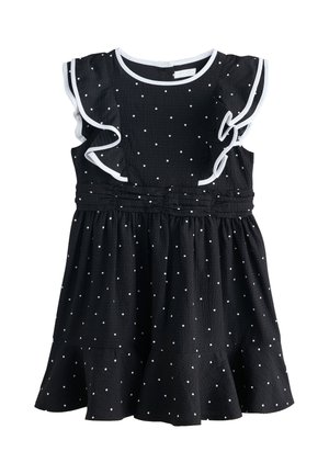 Schwarzes ärmelloses Kleid mit weißen Punkten, Rüschenbesatz an den Schultern, geraffter Taille und ausgestelltem Saum.