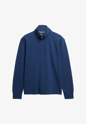 Marineblå pullover sweatshirt med høj krave, kvart lynlås og broderet logo. Blødt materiale, lange ærmer, ribbede manchetter.