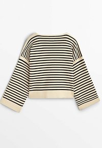 Pull couleur crème avec des rayures horizontales noires, manches larges, poignets et ourlet côtelés, posé à plat sur fond blanc.