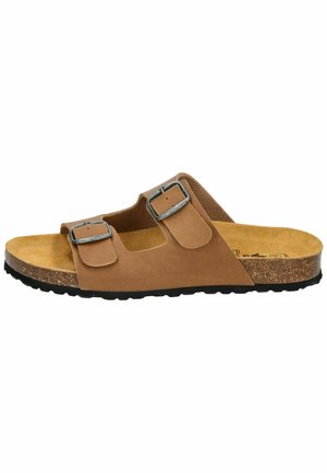 Brown slide sandal with two adjustable metal buckle straps, cork footbed, and textured black rubber sole, viewed from the side.