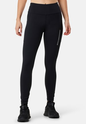 Black athletic leggings with a high waist, featuring side pockets and reflective details along the seams. Made from smooth, stretchy material.