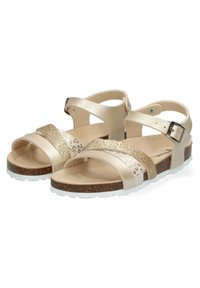 Sandalias beige con tiras brillantes, suela de corcho texturizada y suela de goma blanca. Presentan un hebilla ajustable y acentos de estampado animal.