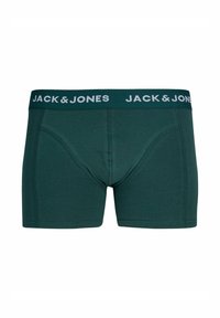 Temno zeleni raztegljivi bombažni bokserice s širokim elastičnim pasom, na katerem je v beli barvi napisane blagovne znamke "JACK & JONES". Vidne so šive.