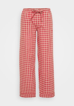 Czerwono-kremowe piżamowe spodnie w kratę z paskiem do regulacji w talii, szerokimi nogawkami i miękką fakturą. Wzór składa się z równych kwadratów i jest starannie wykończony.