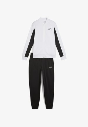 Hvid og sort træningsdragt, der har en lynlåsjakke med logo på brystet og matchende sorte bukser med logo, lavet af glat stof.