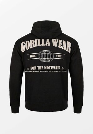Zwarte hoodie met de tekst "GORILLA WEAR", een afbeelding van een wereldbol, "Since 1982" en de slogan "For the Motivated" op de achterkant.