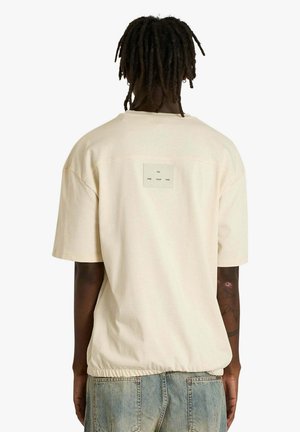 T-shirt con stampa - beige