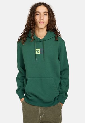 Groene hoodie met een voorzak, verstelbare capuchon en een grafisch ontwerp in geel en paars op de borst. Van katoenmix stof.