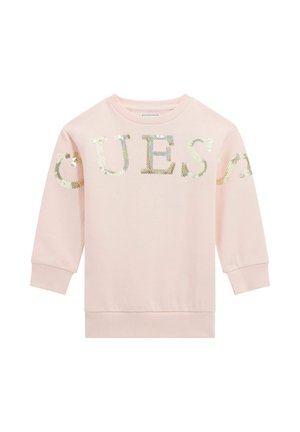 Różowa bluza z cekinowym napisem "GUESS". Materiał jest miękki, a rękawy i dół są wykończone ściągaczem, co zapewnia dopasowane wykończenie.