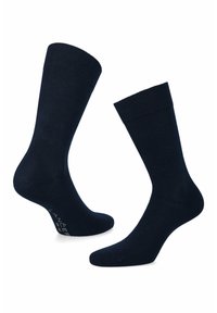 Granatowe skarpetki bawełniane z prążkowanym ściągaczem, bezszwowym czubkiem oraz subtelnym logotypem na podeszwie. Gładka faktura i regularny krój.