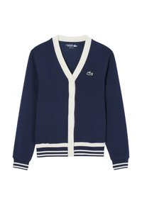 Cardigan blu navy con scollo a V, bordatura crema, sette bottoni sulla parte anteriore e un logo verde sul lato sinistro del petto. Polsini a righe sulle maniche.