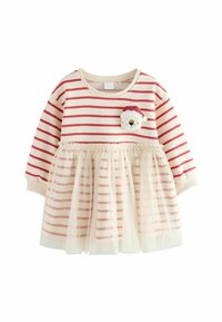 Rochie cu dungi roșii și albe, cu un top dintr-o țesătură moale, o fustă din tul transparent și o aplicație cu un urs pe piept care poartă o pălărie de Moș Crăciun.